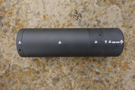 Schultz & Larsen Venom cylinder, featuring a 14x1mm thread, optimized for sound reduction and minimal recoil, displayed on a stone surface.