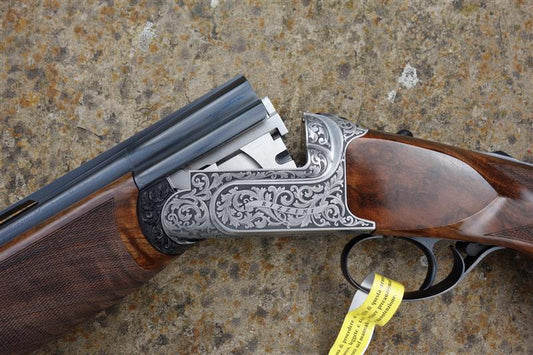 Close-up of B Rizzini BR460 EL Sporting, showcasing its engraved receiver, detachable trigger, and Turkish walnut stock with palm swell grip.
