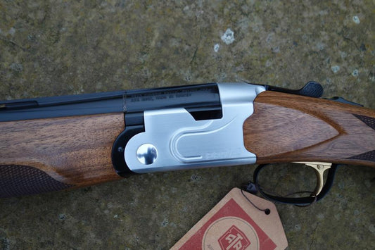 ATA Pro 12 Competition Sporting gun, close-up showing the adjustable comb, palm swell grip, and trap style forend with finger groove.