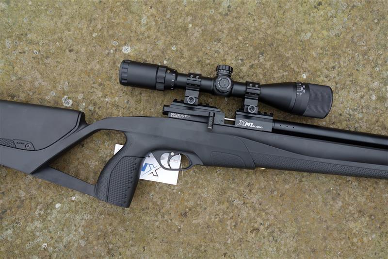 Stoeger XM1 Scout rifle with a scope, featuring side lever cocking and five 10-shot magazines, ideal for precise shooting.