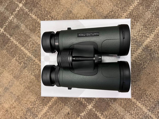 Hawke Nature-Trek 8x42 Binoculars on a white box, showcasing black lenses and optical precision, known for outstanding clarity and lifetime warranty.