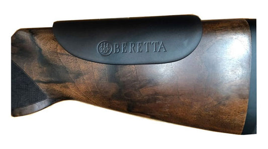 Close-up of Beretta Gel-Tek Cheek Protector on a gun, showing its placement on wooden or synthetic stocks for enhanced shooting comfort.