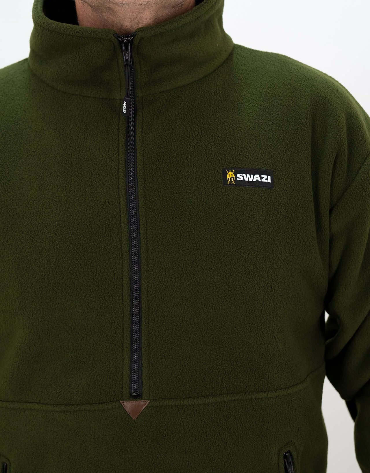 Swazi Doughroaster | Comfortable Fleece Jumper | Olive, featuring a long chest zipper, high collar, and zippered kangaroo pocket, worn by a person.