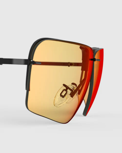 Ranger Edge Lens sunglasses by RIACT A.I & Claysight feature distinctive orange lenses, offering a stylish accessory option for various occasions.