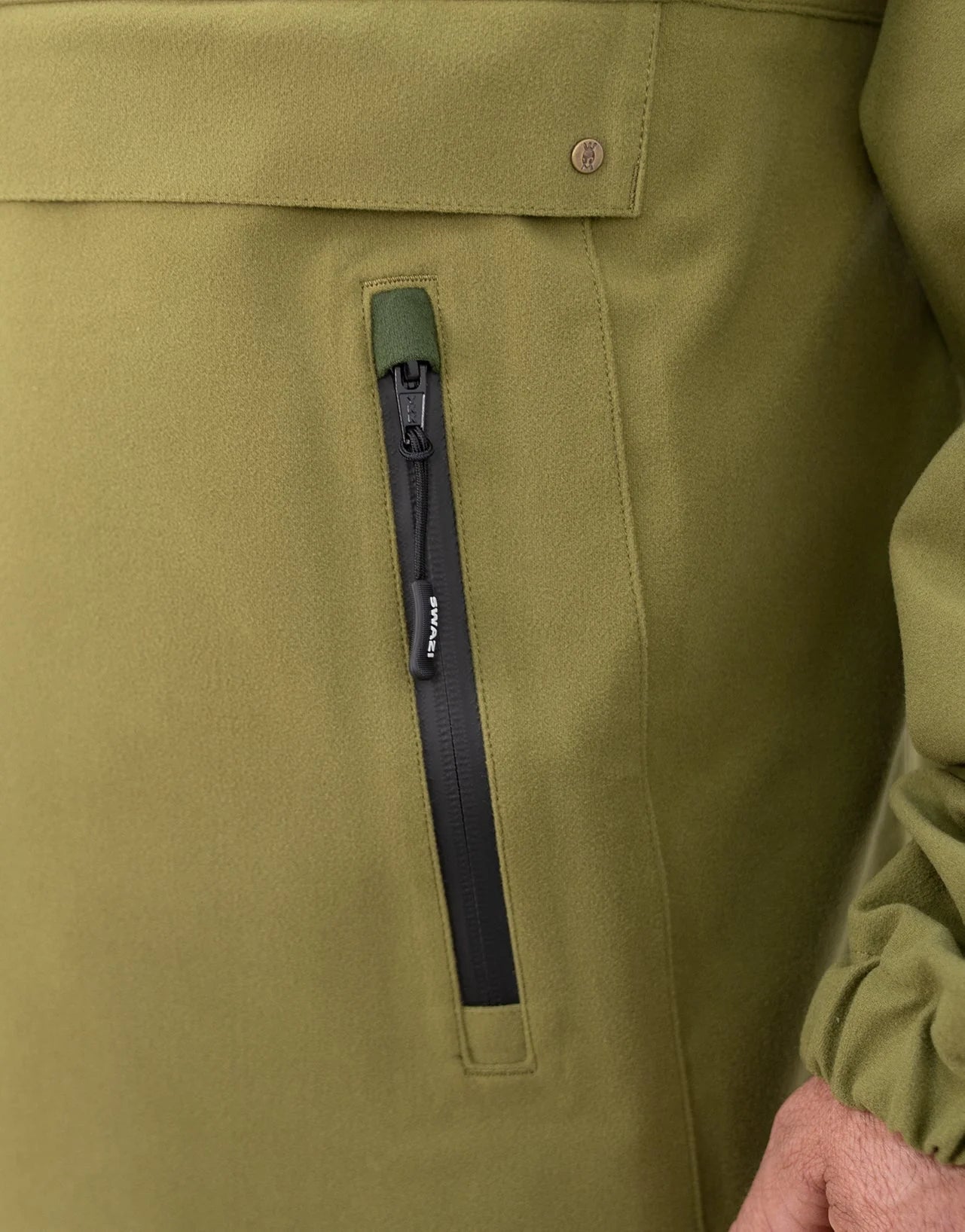 Swazi Kagoule Anorak | Quiet Waterproof Hunting Jacket showcasing water-resistant zippers, top opening pocket, and adjustable features, ideal for hunters needing accessible, dry storage.
