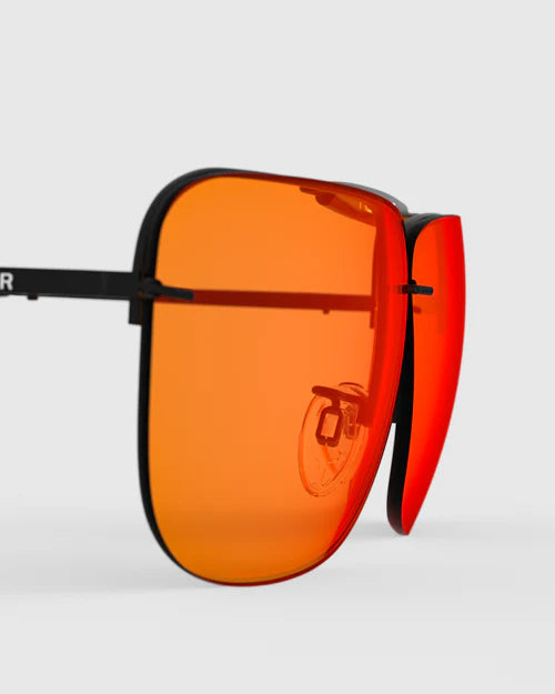 Ranger Edge Lens sunglasses featuring distinct orange lenses, part of the RIACT A.I & Claysight line, offering stylish eyewear with enhanced vision care.