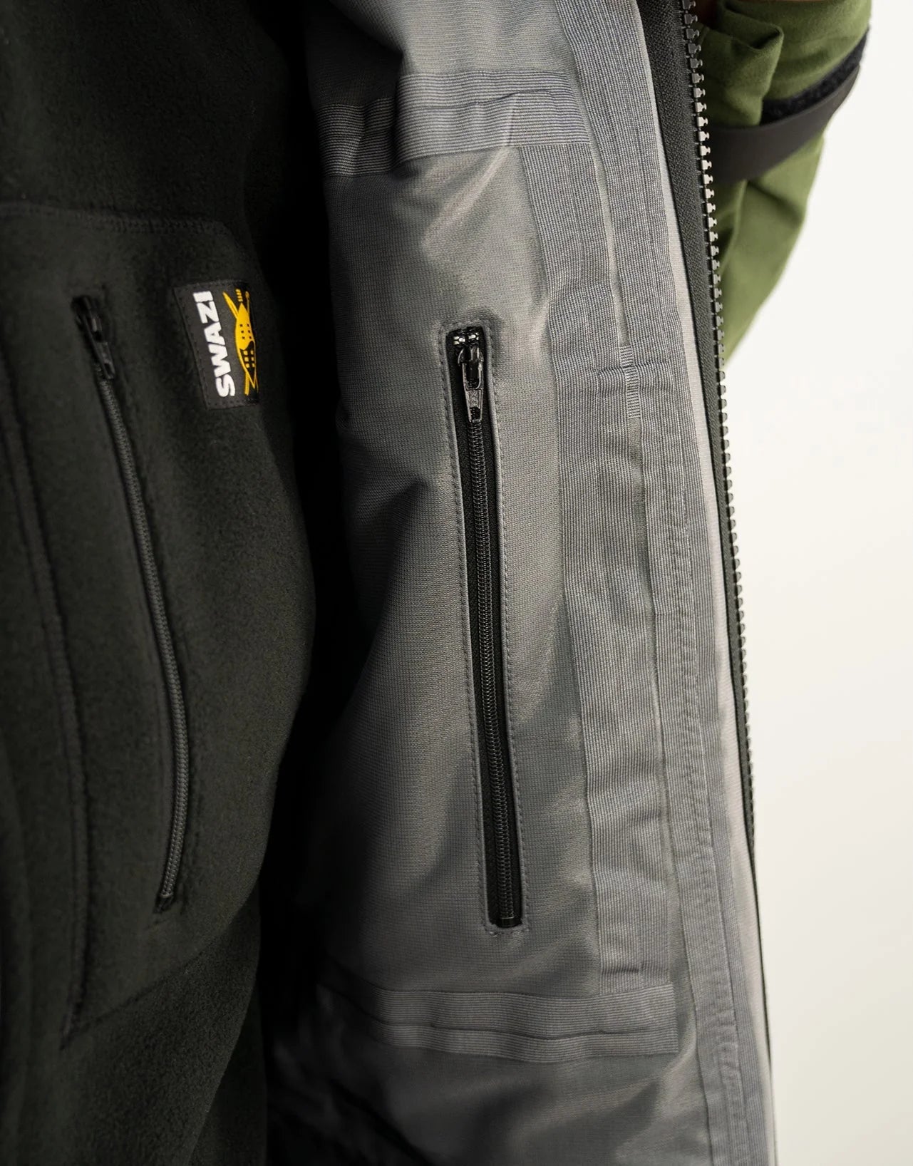 Close-up of the Swazi Wapiti XP Men's Hunting Jacket, highlighting the durable two-way YKK zipper and soft, waterproof AEGIS® Whisper fabric.
