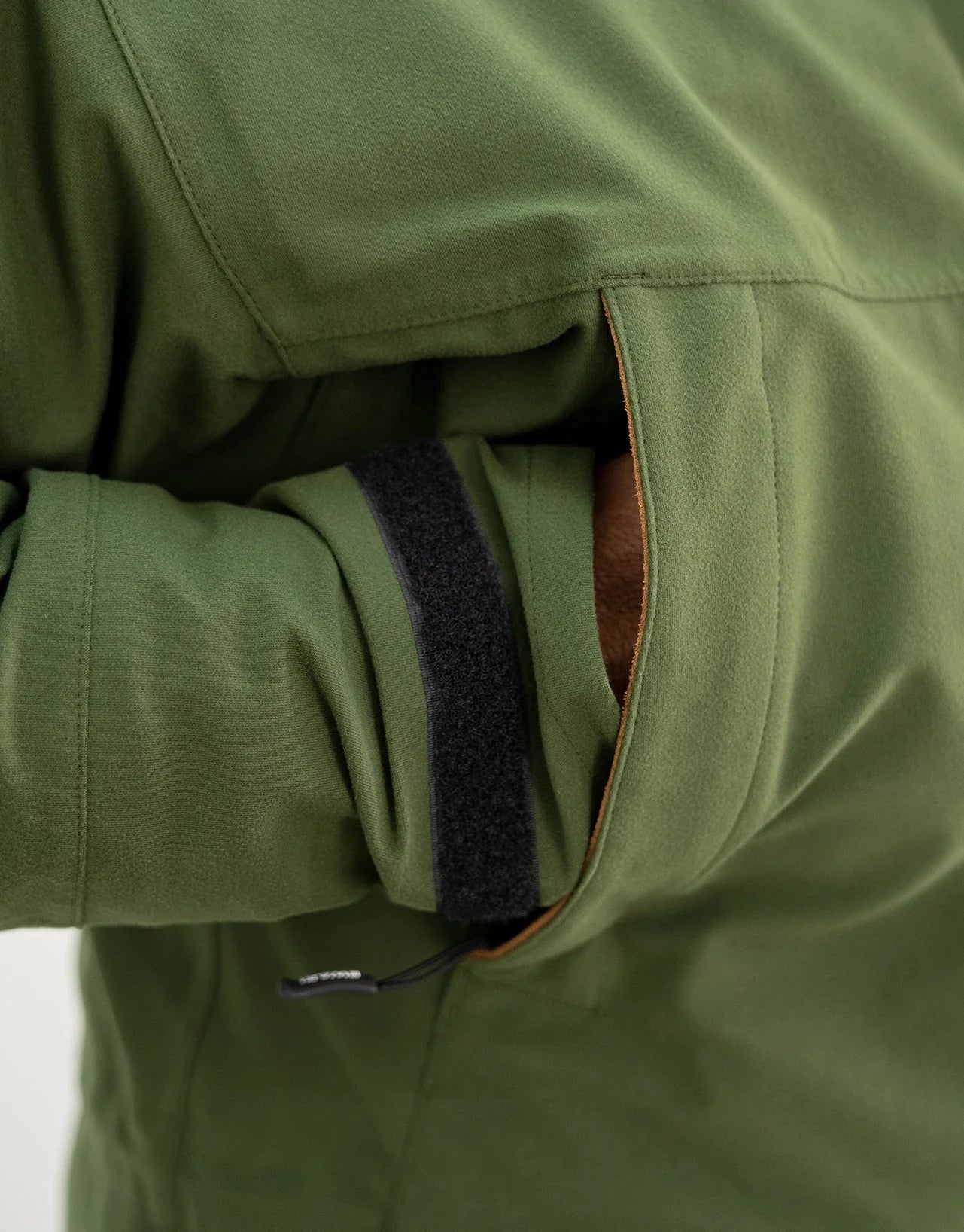 Swazi Wapiti XP Men's Hunting Jacket featuring a zip-off hood, hand warmer pockets, and a durable outer made from quiet, waterproof AEGIS® Whisper fabric.
