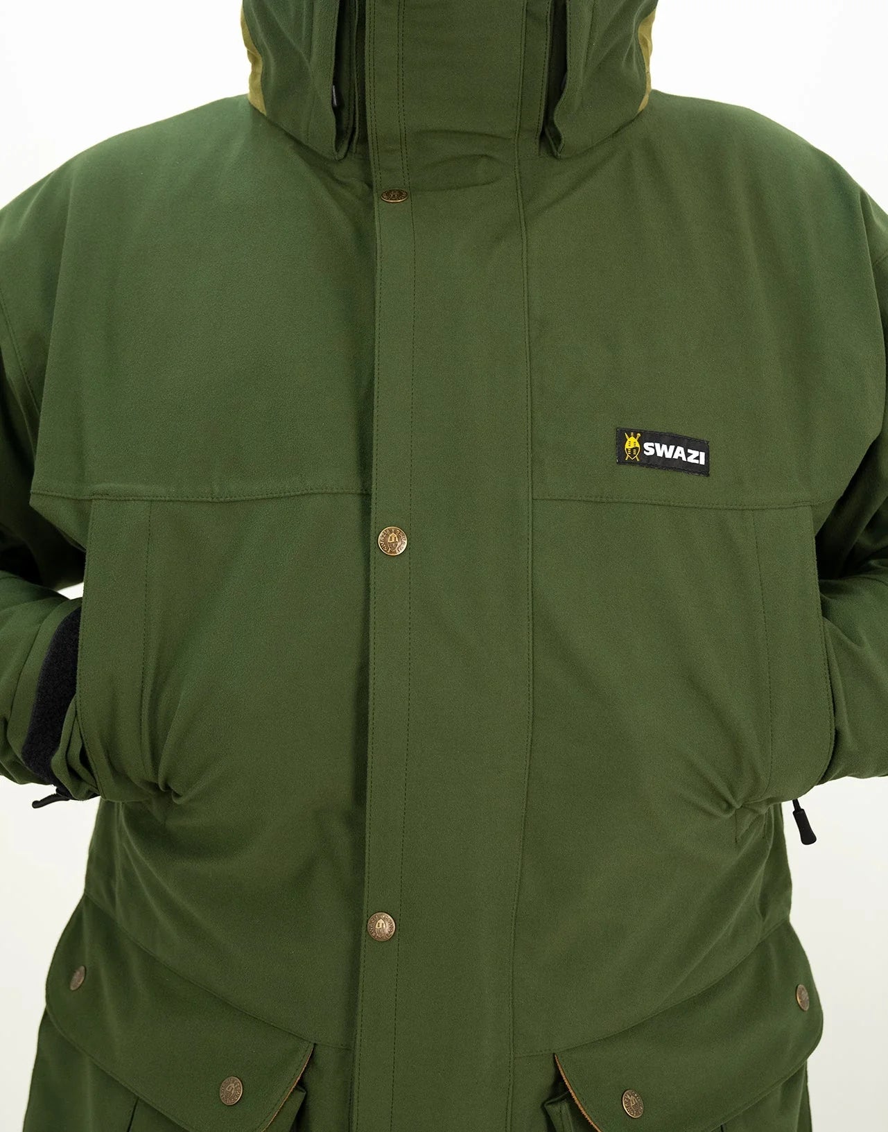 Swazi Wapiti XP Men's Hunting Jacket showcased on a person, highlighting its green fabric, button details, and durable design features like a zip-off hood and water-resistant zippers.