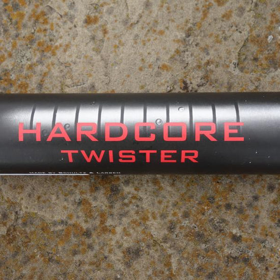 Schultz & Larsen Micro CF moderator, black cylinder with red text, compact design, 160mm length, 34mm diameter, muzzle forward fitting, 256g weight.