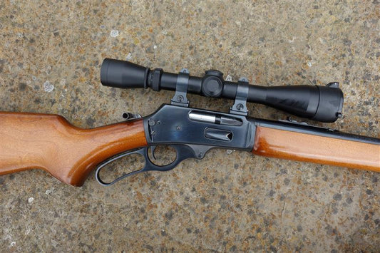 Marlin 30AS rifle with Leupold scope, Talley rings, 20 barrel, pistol grip stock, and leather sling, designed for woodland stalking.