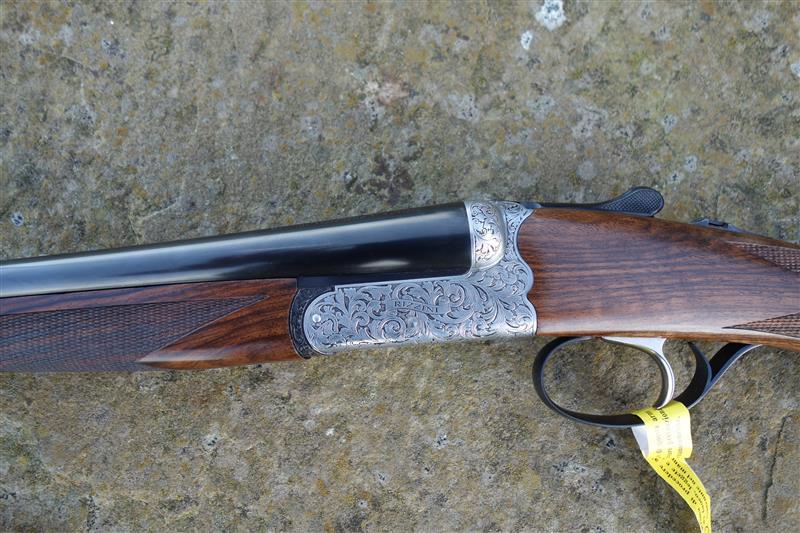 B Rizzini BR550 Side by Side with floral scroll engraving, pistol grip stock, and slim splinter forend, featuring a single selective trigger.