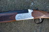 Kofs Sceptre SXE Youth Game, a firearm on a rock, featuring a 13 junior stock, soft rubber butt pad, and single trigger ejector.