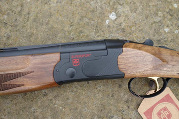 Close-up of ATA Supersport Sporting gun, featuring a detailed view of its matt black action, red accents, and adjustable comb, highlighting its competition-ready design.