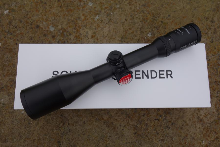 Schmidt & Bender Classic 3-12x50 Rifle Scope on a white box, featuring an illuminated L3 reticule and ASV BDC elevation turret for precise adjustments.