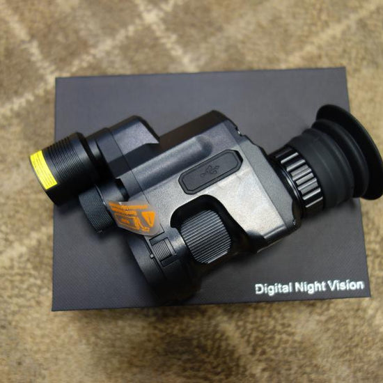 PARD NV007SP Gen 2 Night Vision device, compact design with adjustable LED/IR light, shown on a box, featuring a visible logo.