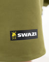 Swazi Kagoule Anorak, a quiet waterproof hunting jacket, showcases a close-up of its green fabric and distinctive logo, highlighting its durable, water-resistant features.