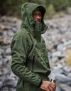 Swazi Tahr Ultralite Jacket showcased on a man outdoors, highlighting its hood and chest pockets, ideal for waterproof, breathable hunting or hiking.