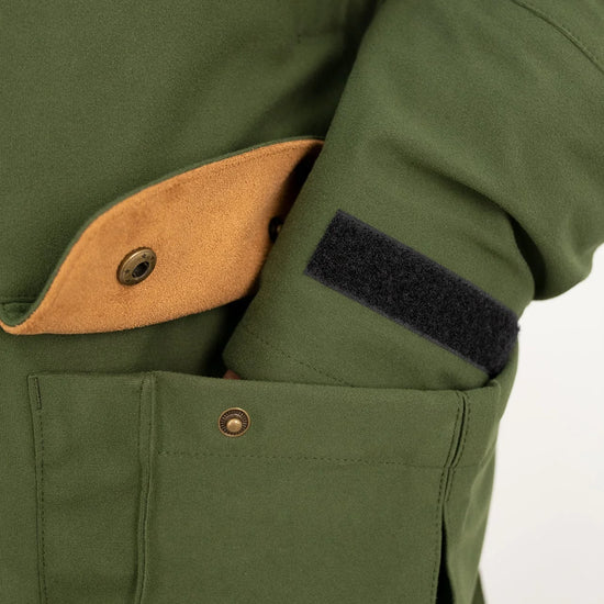 Swazi Wapiti XP Men's Hunting Jacket close-up, showcasing button and pocket details, emphasizing durable, quiet, waterproof fabric ideal for outdoor activities.