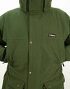 Swazi Wapiti XP Men's Hunting Jacket showcased on a person, highlighting its green fabric, button details, and durable design features like a zip-off hood and water-resistant zippers.